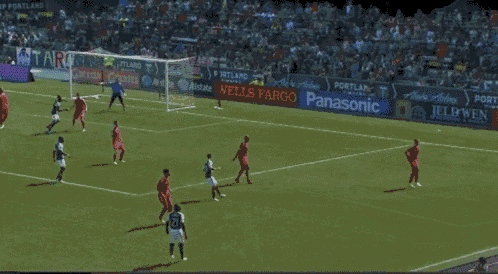 a soccer game is being played in a stadium sponsored by wells fargo panasonic and atari
