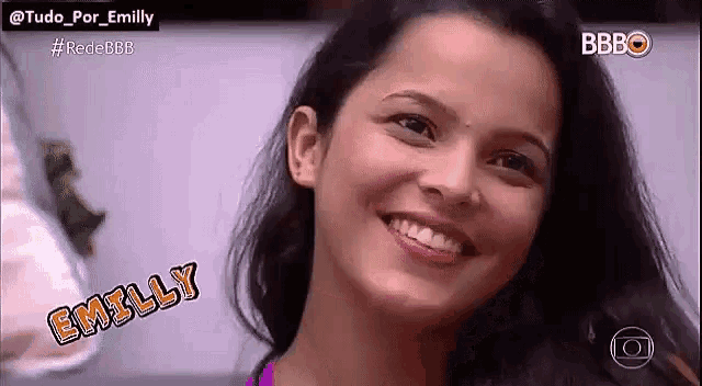a close up of a woman 's face with the word emily on it