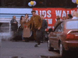 a group of people are standing in front of a bus that says aids walk