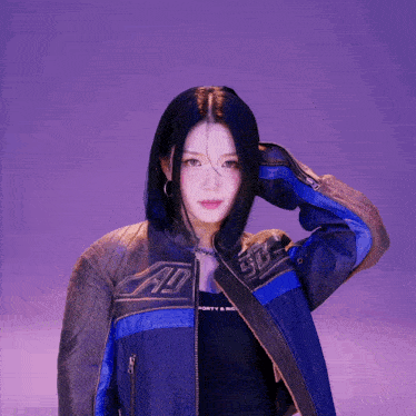 a woman wearing a jacket that says ad