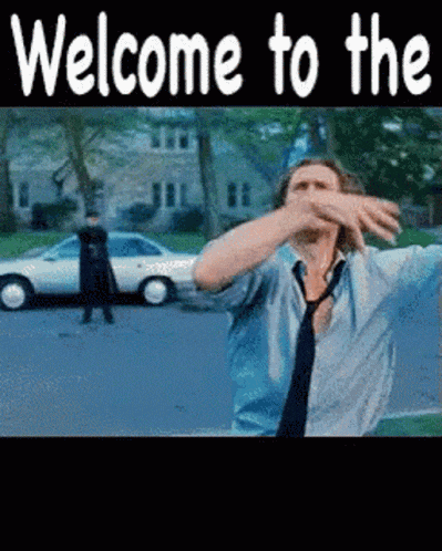 a man in a blue shirt and tie is dancing in front of a car with the words welcome to the in white letters