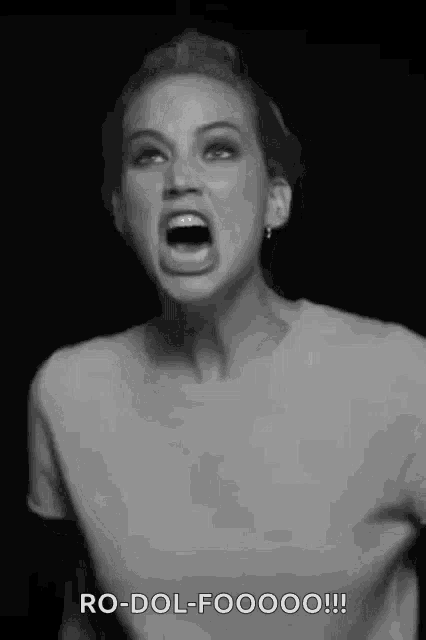 a black and white photo of a woman with her mouth open and the words ro-dol-foooo written below her