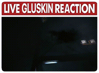 a sign that says ' live gluskin reaction ' on top of a black background
