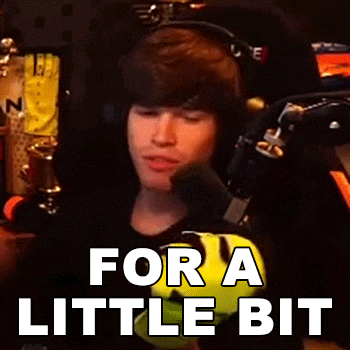 a man wearing headphones is sitting in front of a microphone with the words for a little bit below him .