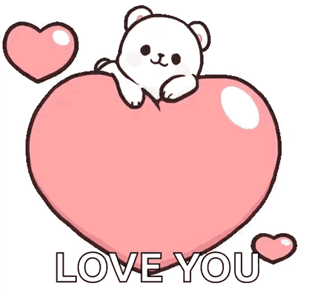 a white bear is sitting on top of a pink heart .