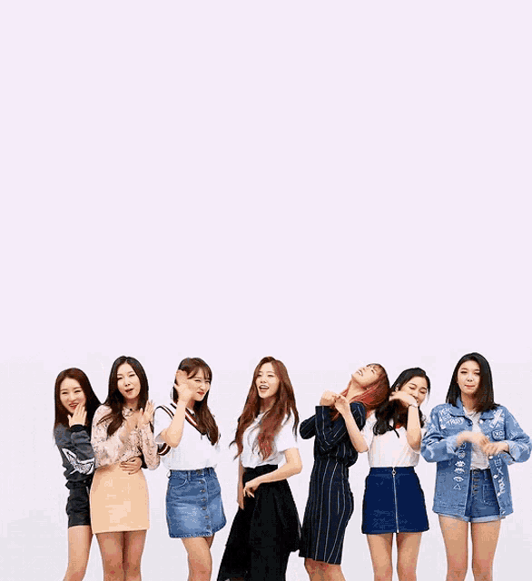 a group of girls standing next to each other with one wearing a jacket that says ' denim ' on the front