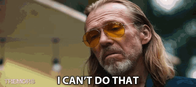 a man with long hair and a beard is wearing sunglasses and saying " i can 't do that "