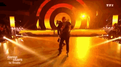 a couple dancing on a stage that says danse stars