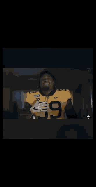 a football player wearing a number 99 jersey