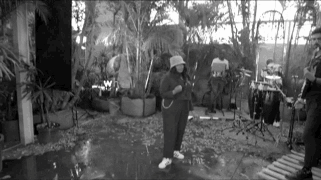 a black and white photo of a band playing instruments