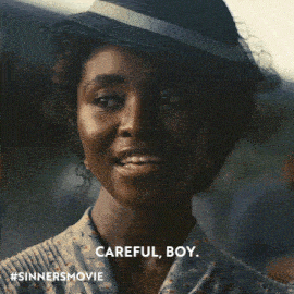 a close up of a woman wearing a hat with the words careful boy below her