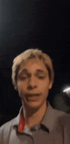 a close up of a man 's face with his mouth open