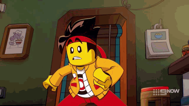 a cartoon character is standing in front of a wall that says 9 now