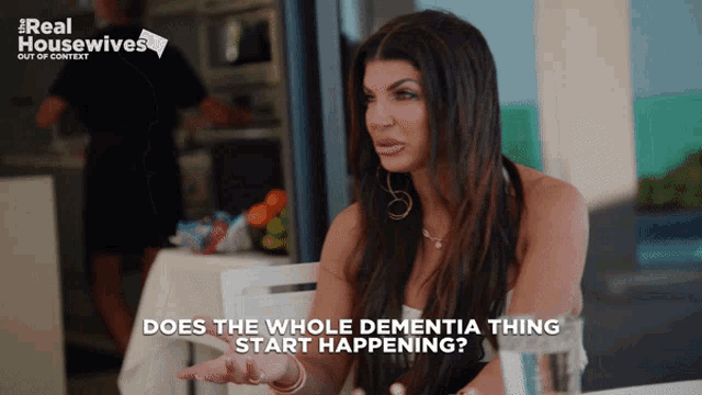 a woman is sitting at a table with the words " does the whole dementia thing start happening "