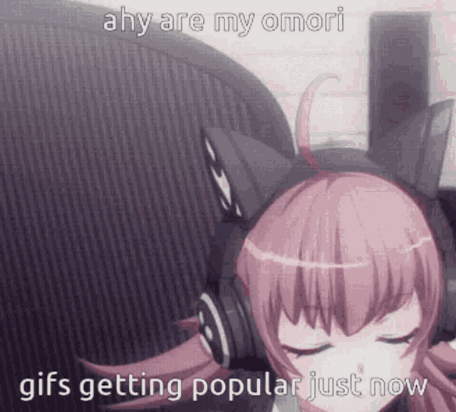 a girl wearing headphones is sitting in front of a microphone .