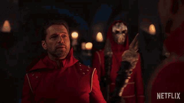 a netflix ad shows a group of people in red robes