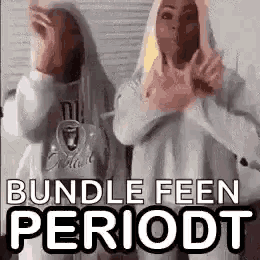 two women are standing next to each other in front of a mirror and making funny faces .