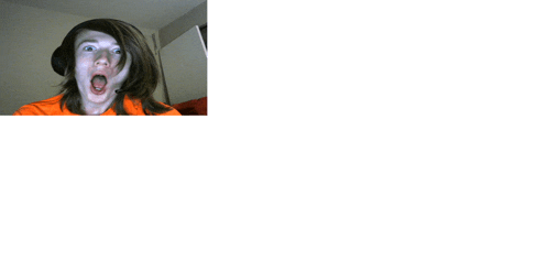 a woman wearing headphones is making a funny face