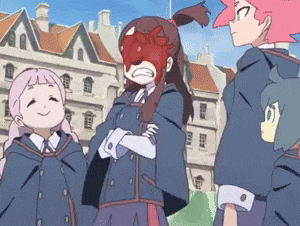 a girl with a red mask on her face is standing next to two other girls