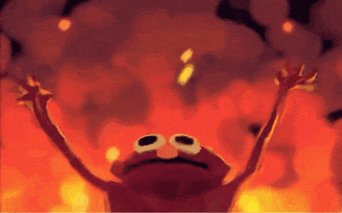 elmo from sesame street is holding his arms up in the air in front of a fire .