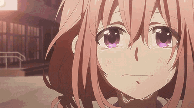 a girl with pink hair and purple eyes crying