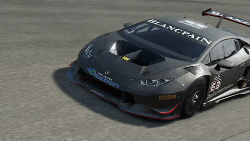 a black race car with the number 63 on the front
