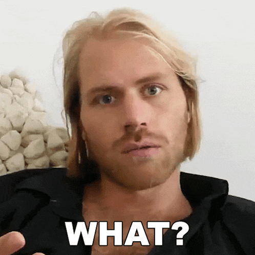 a man with long blonde hair and a beard is asking what