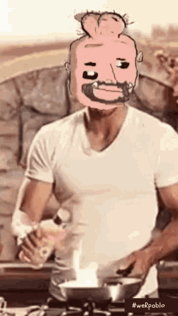a man in a white shirt is cooking with a cartoon face on his face