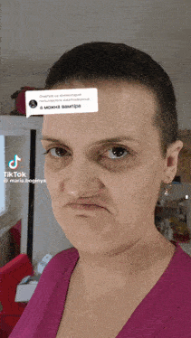 a woman wearing a pink shirt is making a funny face and has a tiktok sticker on her face