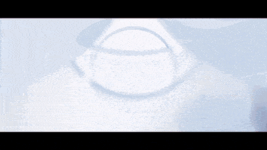 a cartoon character is laying on the ground in a white circle
