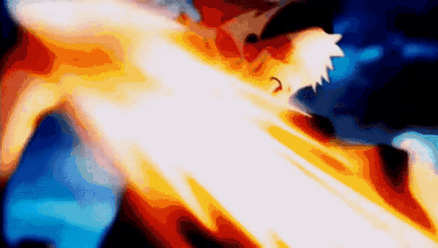 a blurry picture of a person holding a sword with a flame coming out of it