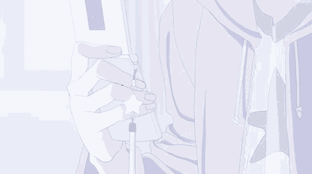 a person in a hoodie is holding a cell phone with a star on it