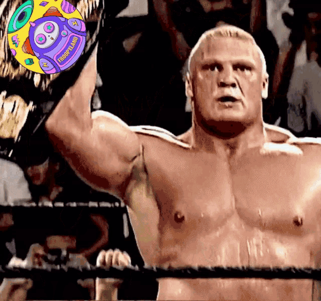 a shirtless wrestler in a ring holds up his championship belt with a sticker on it that says ' trump '