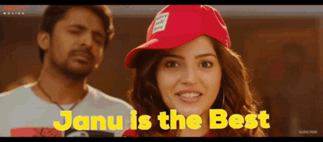 a woman wearing a red hat with the words janu is the best on it