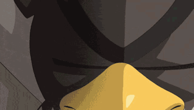 a close up of a person 's face with a yellow mask on