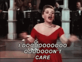 a woman in a red dress is singing and saying i do n't care
