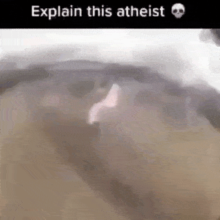 a close up of a person 's face with the words `` explain this atheist '' above it .