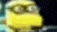 a blurry picture of a yellow cartoon character with a hat on .