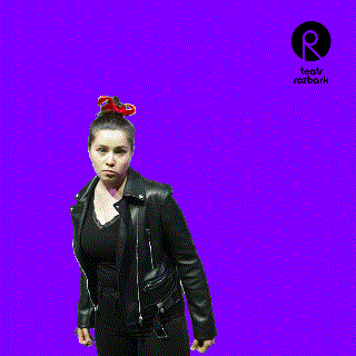 a woman in a black leather jacket is dancing in front of a purple background with a r logo in the corner