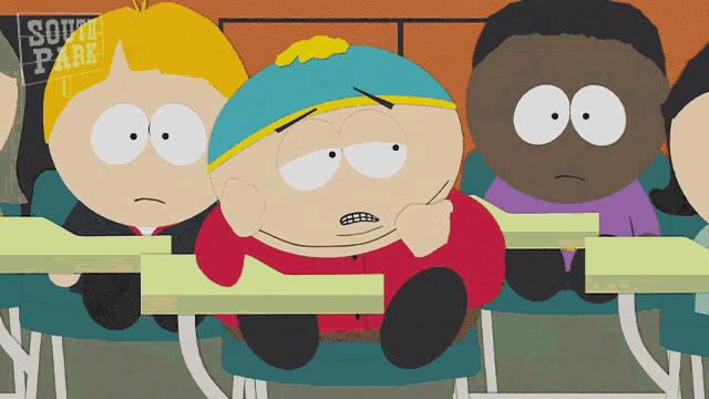 a group of south park characters sitting at their desks