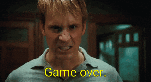 a close up of a man 's face with the words game over on the bottom