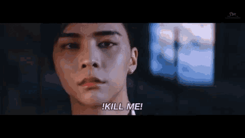 a close up of a man 's face with the words kill me on the bottom
