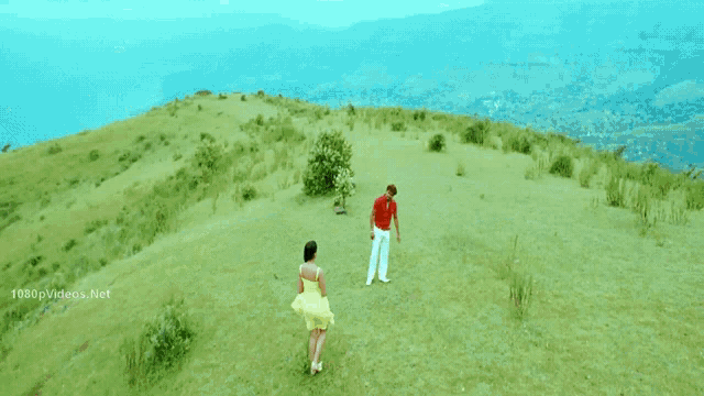 a man in a red shirt is holding a woman 's hand in a scene from a movie