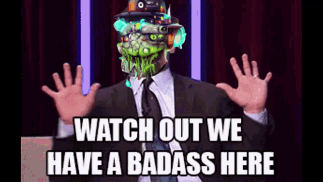 a man in a suit and tie is saying watch out we have a badass here .