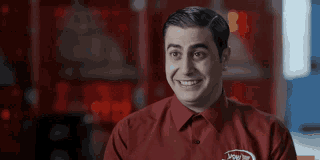 a man wearing a red shirt with ysw on it