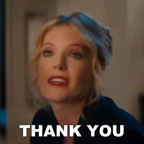 a woman is giving a thank you gesture with her face