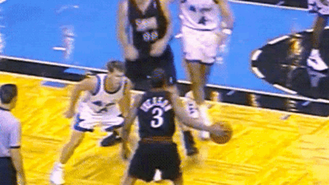 a basketball player wearing a jersey with the number 3 on it
