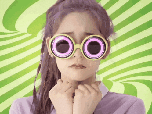 a woman wearing a pair of sunglasses with circles in them