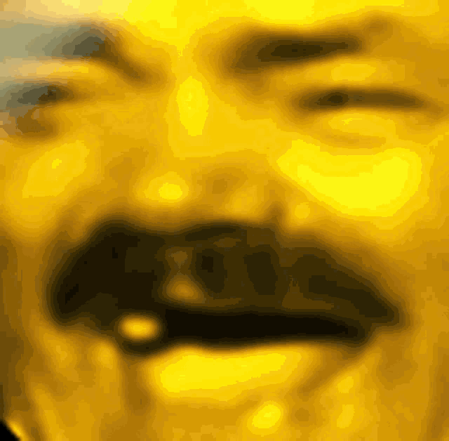 a close up of a man 's face with a mustache in a yellow background .