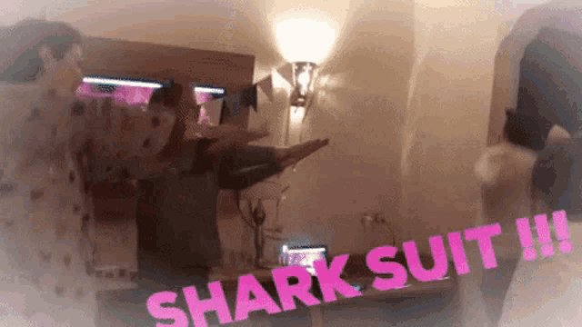 two people dancing in a room with the words shark suit written on the bottom